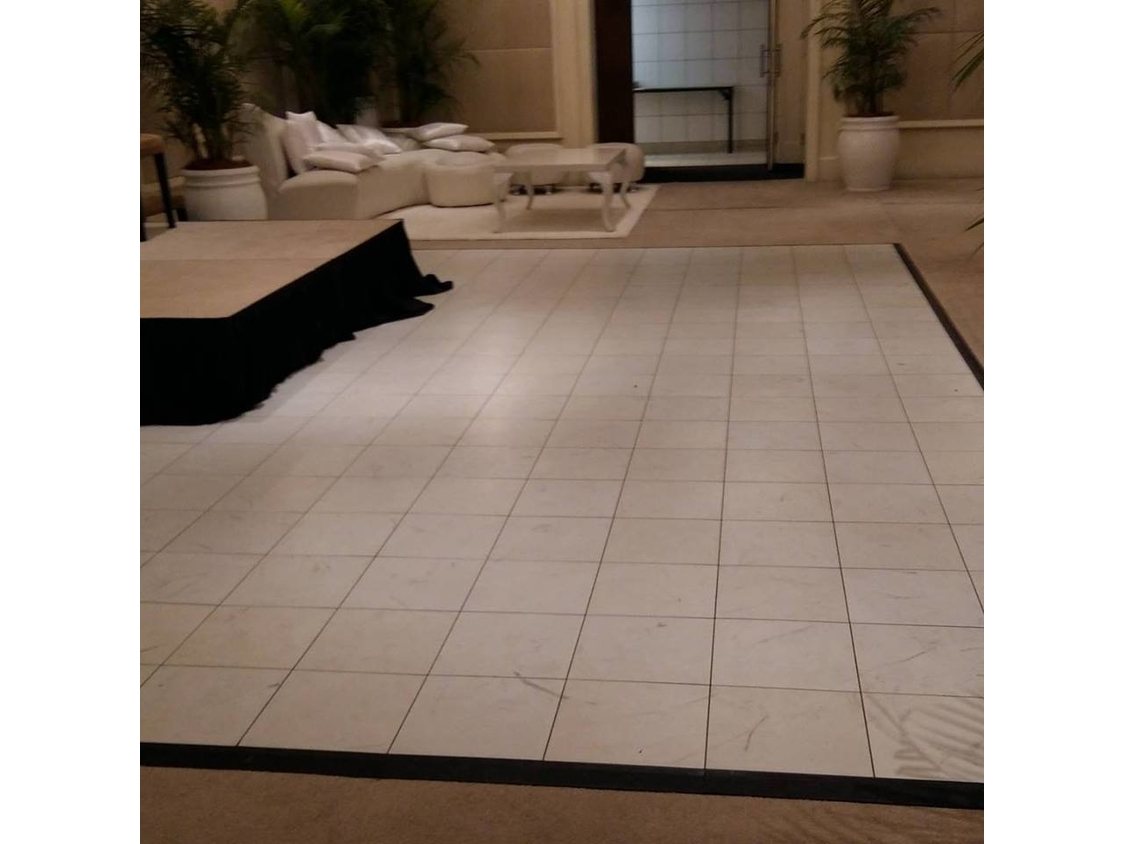 Black and white checkered dance floor in a spacious room