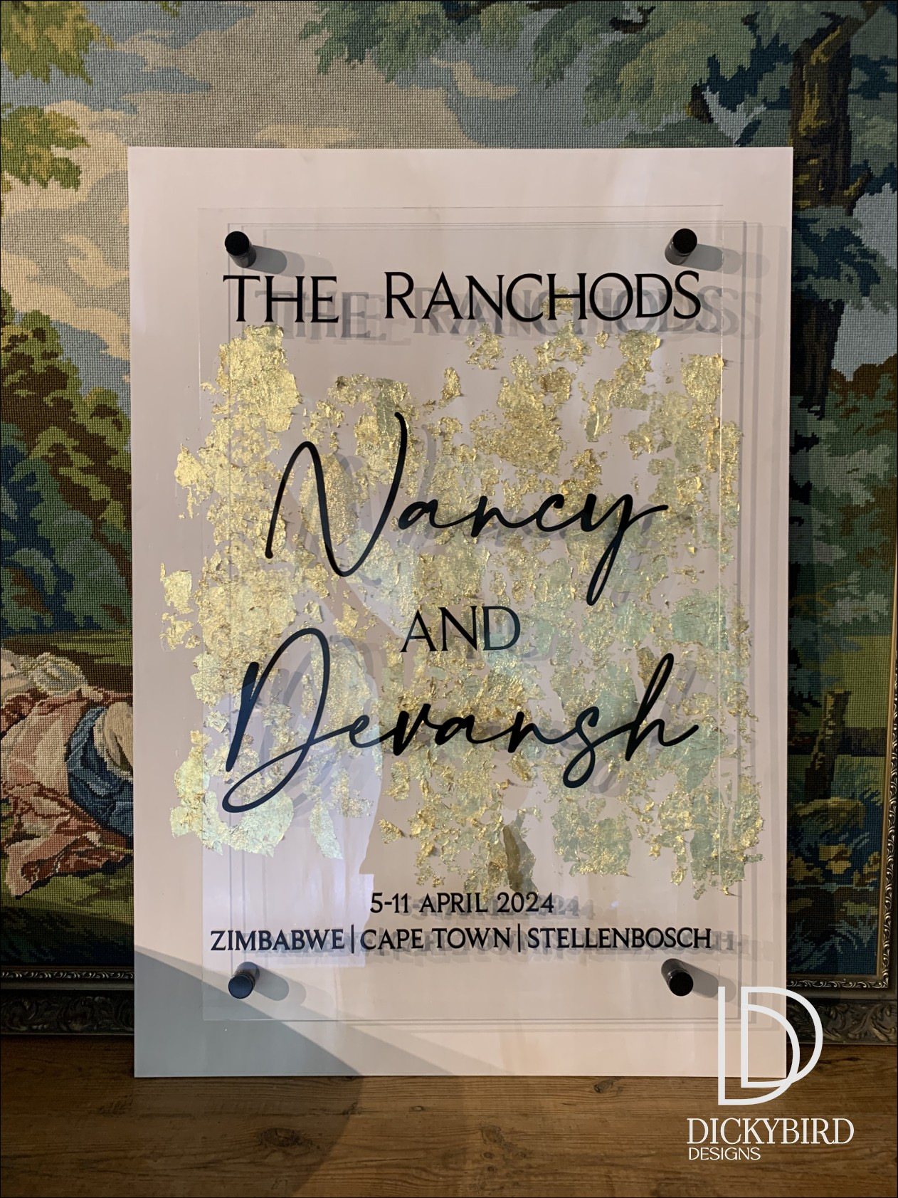 Welcome sign featuring names and event details.