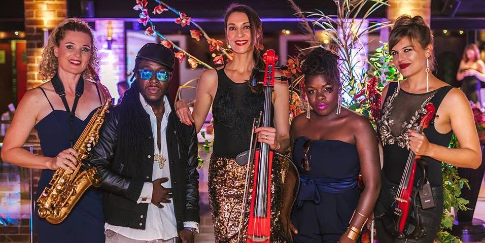 Group of entertainers with instruments at an event