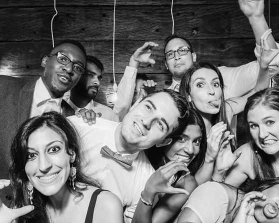 Group of friends smiling and posing at an event
