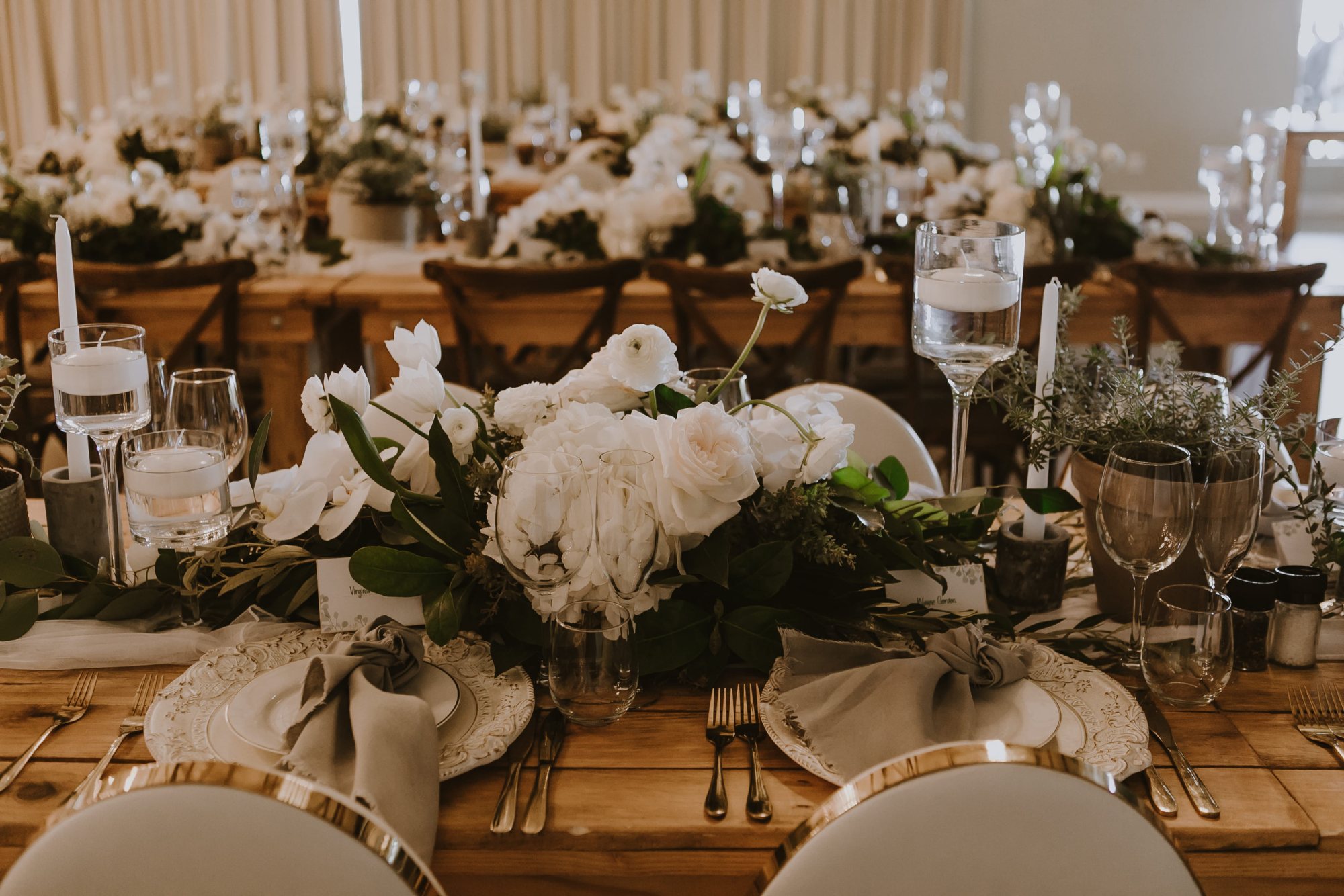 Table set with white flowers and elegant tableware