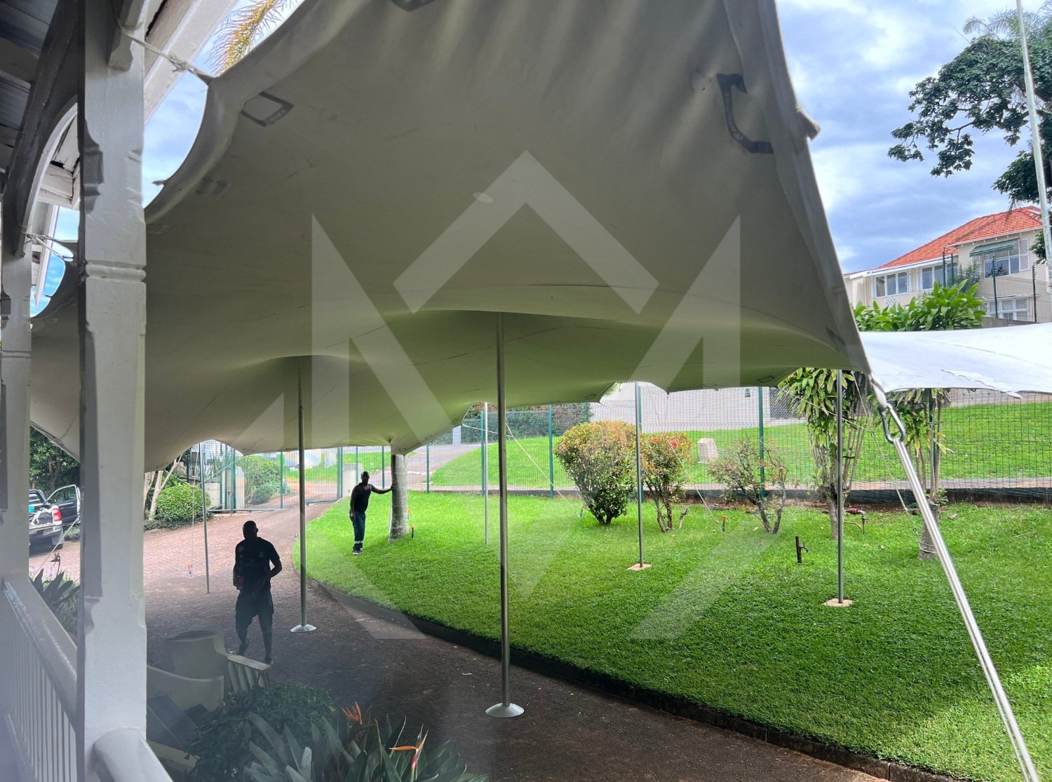 Stretch tent setup in a garden area