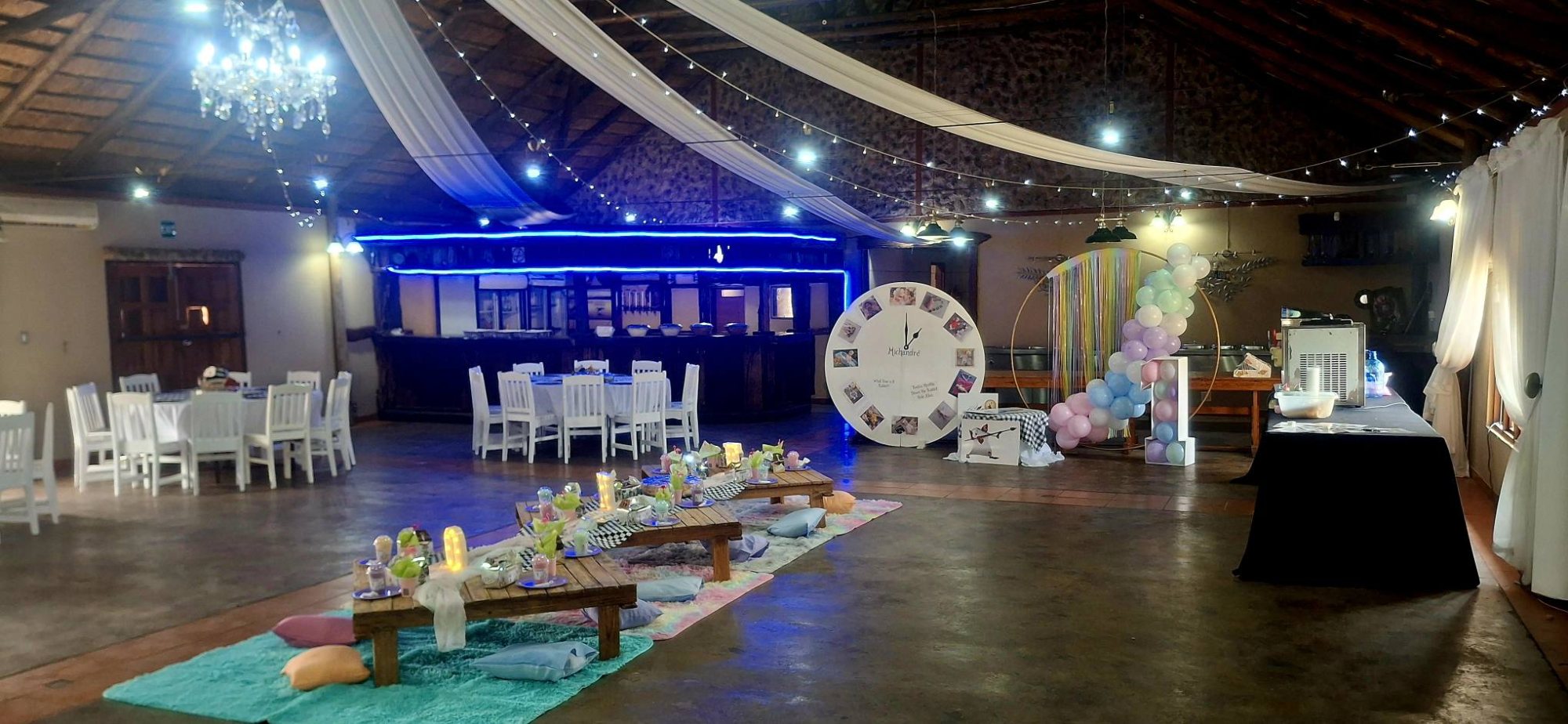 Interior view of an event space with tables and decorations