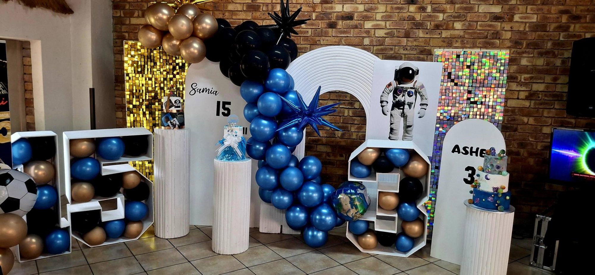 A colorful birthday celebration setup with balloons and themed displays