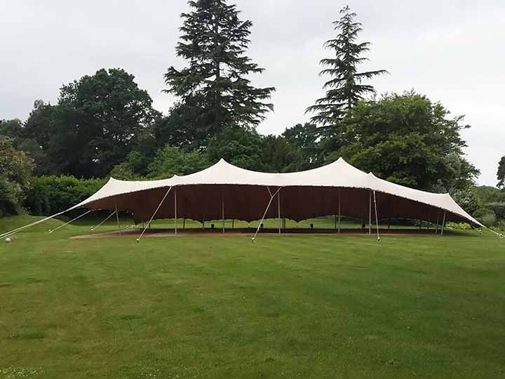 Large waterproof stretch tent on grassy ground