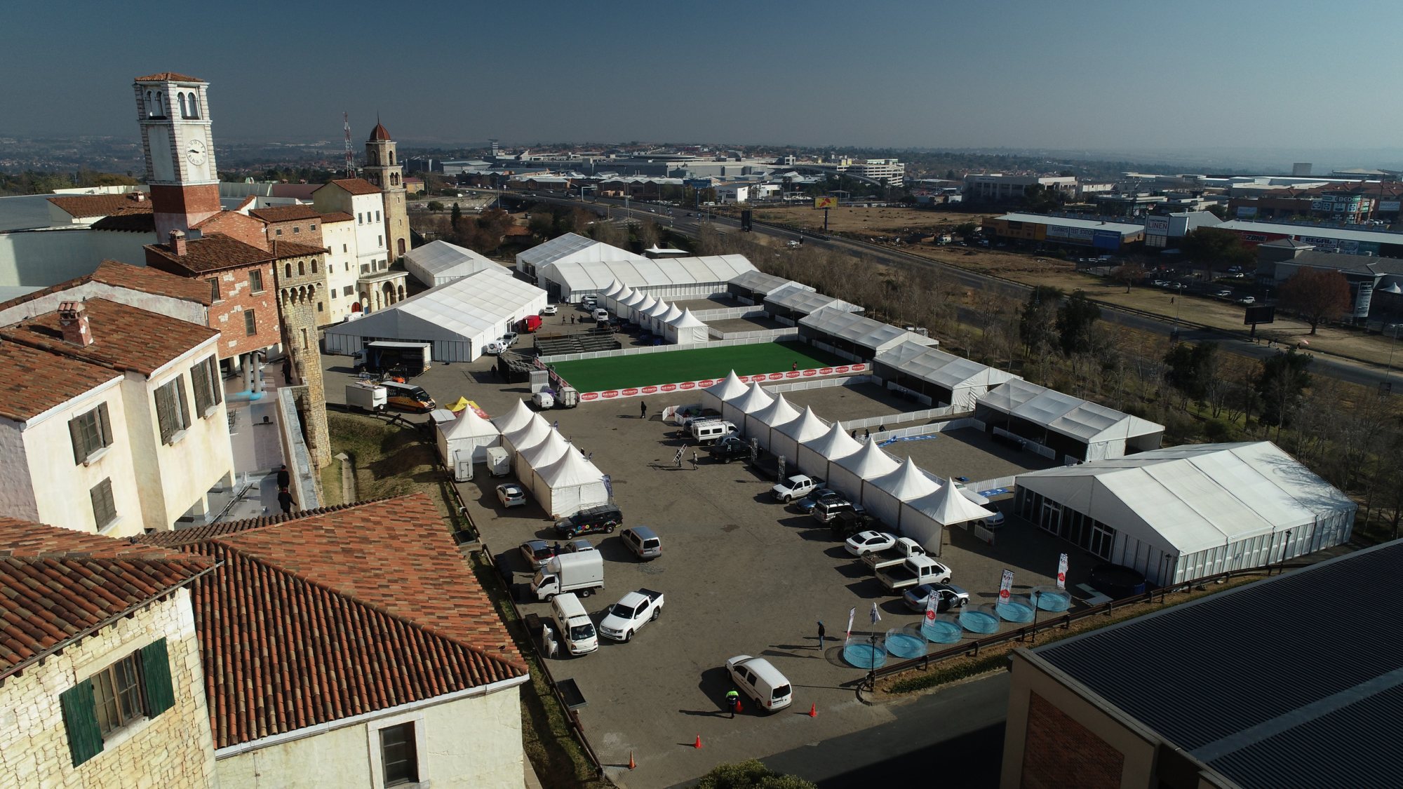 Aerial view of multiple stretch tents arranged for an outdoor event in Randburg.