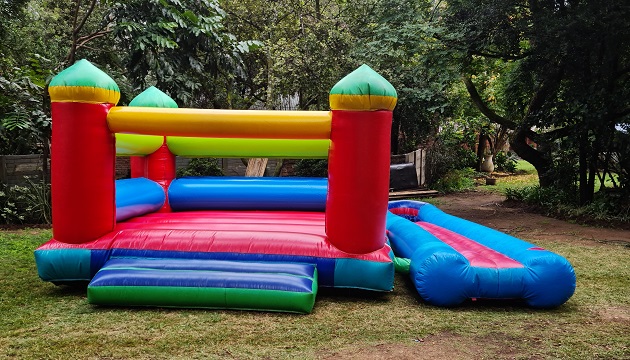 Colorful jumping castle in a garden setting