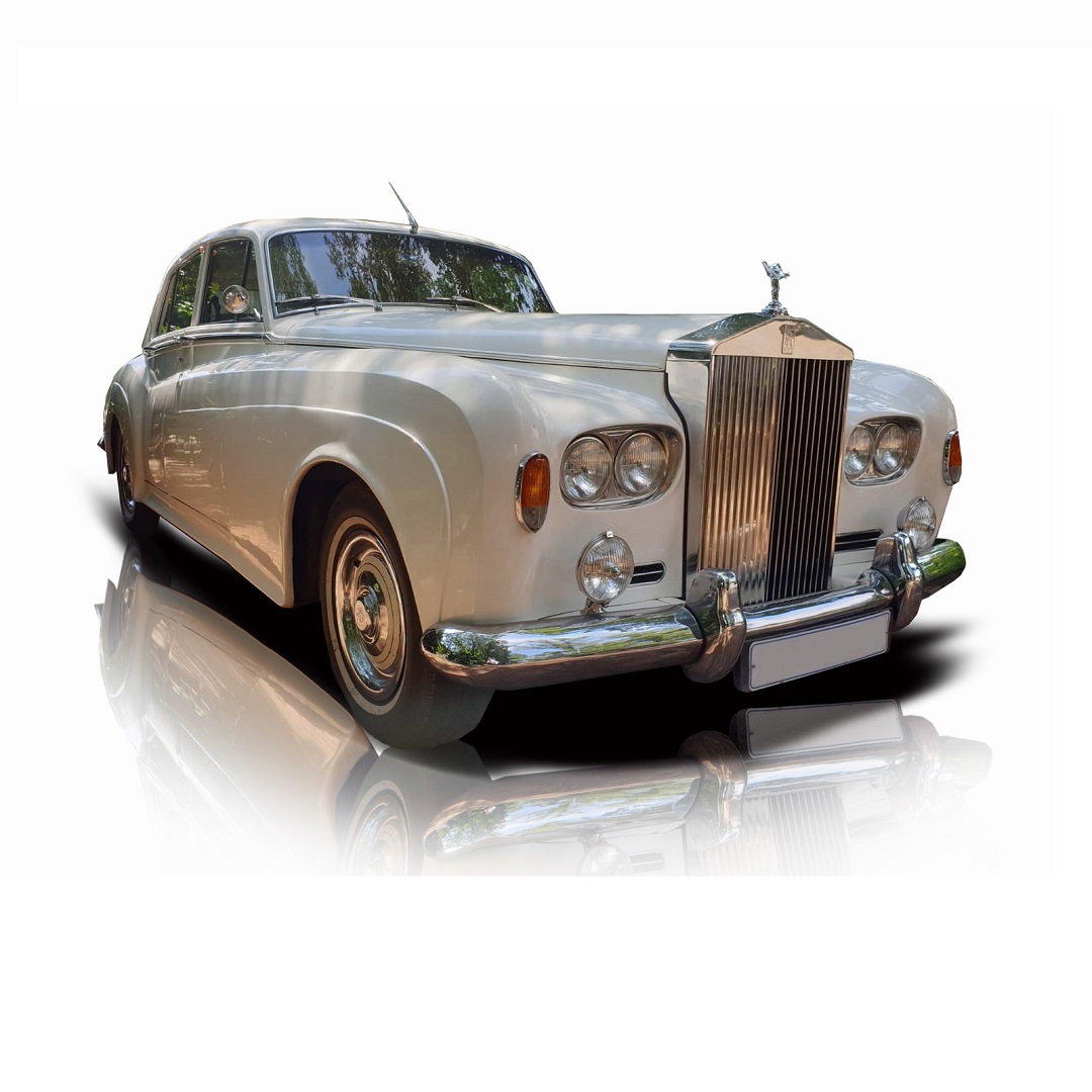 Vintage Rolls Royce with polished chrome and white exterior