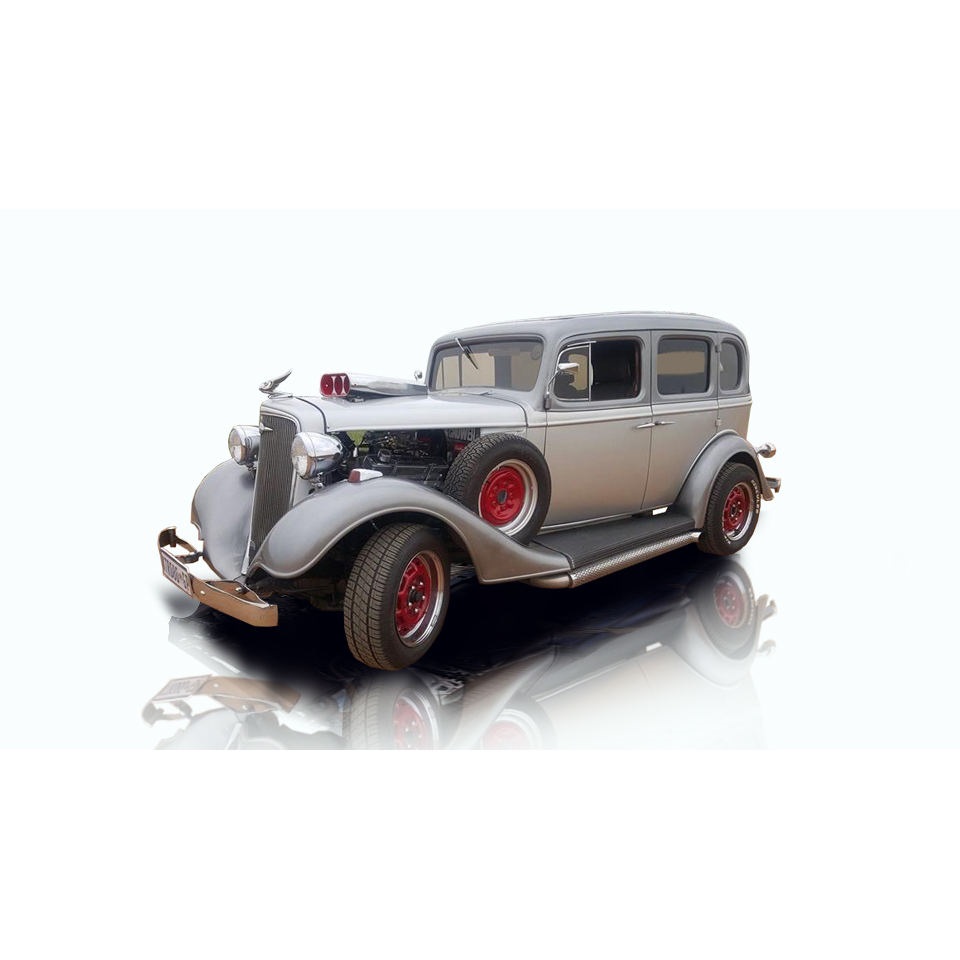 Classic vintage car with red wheels and chrome details