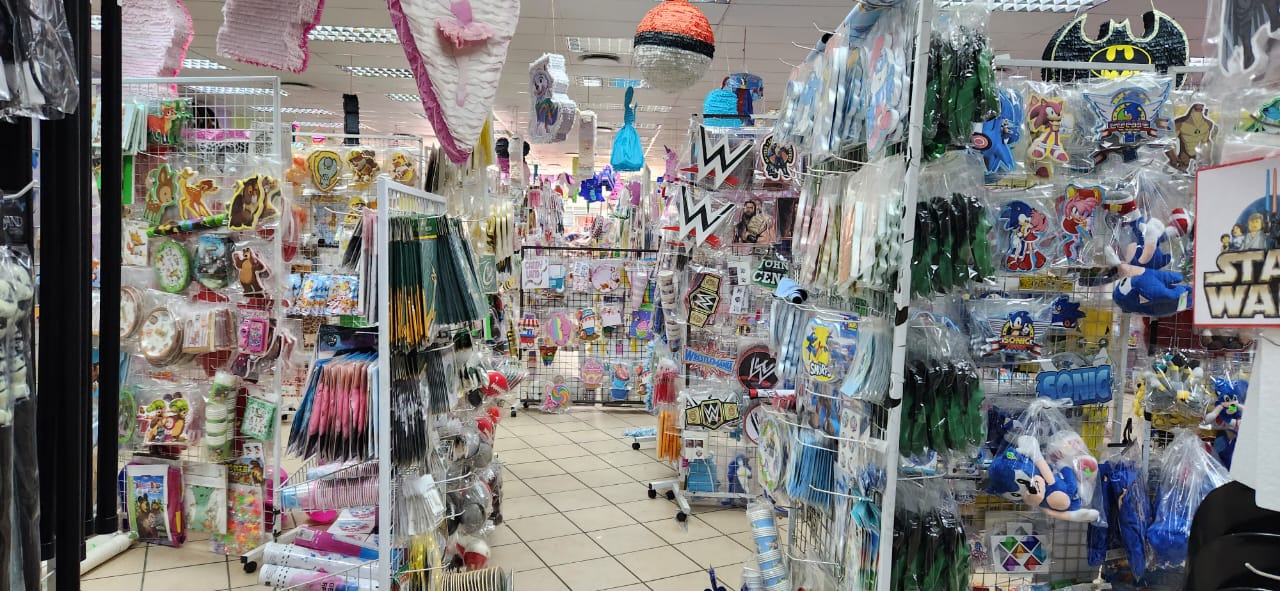 Colorful display of various piñatas in a shop