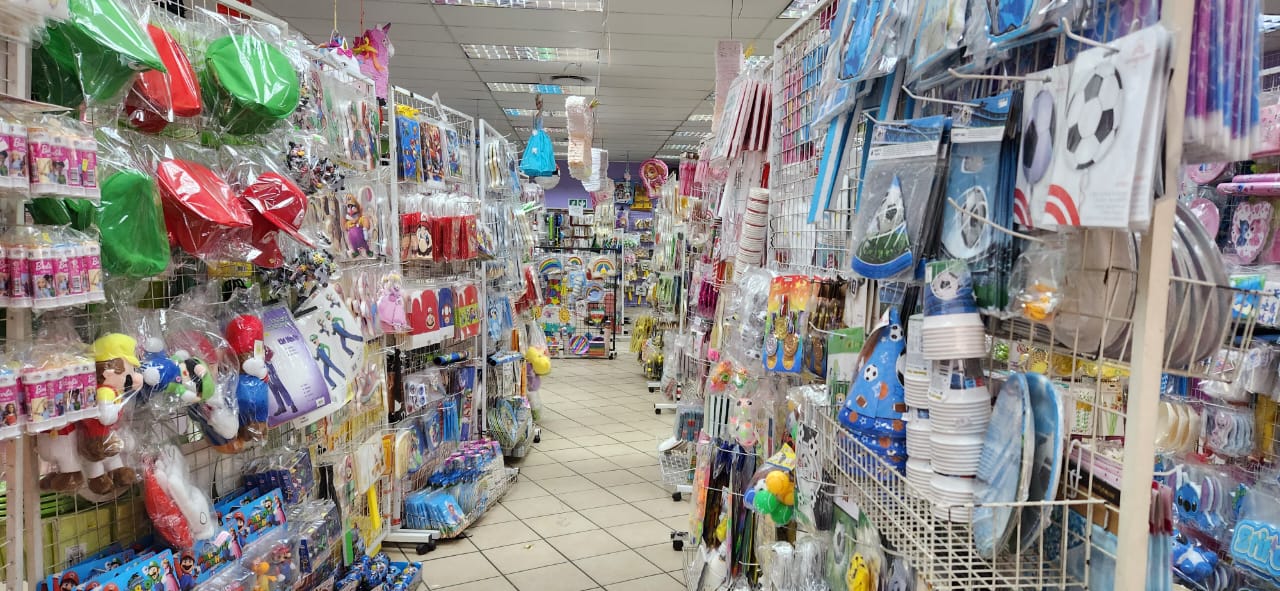 Aisle of colorful party supplies and decorations