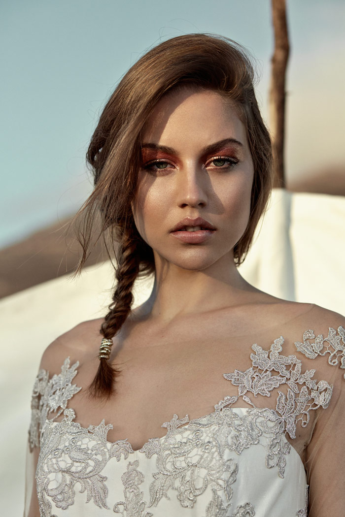 Close-up of a bride with lace dress and makeup