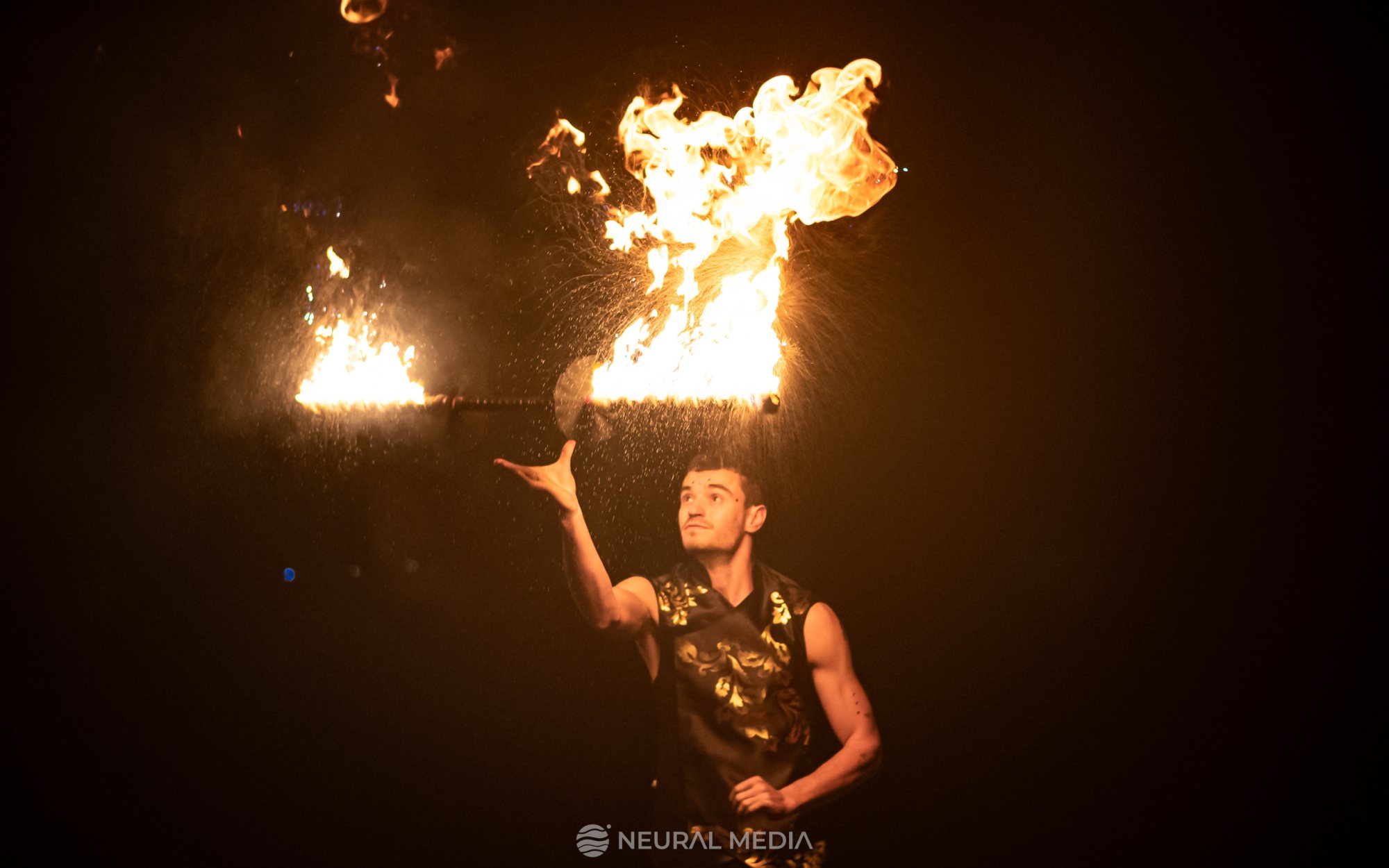 Fire dancer performing with fire torches