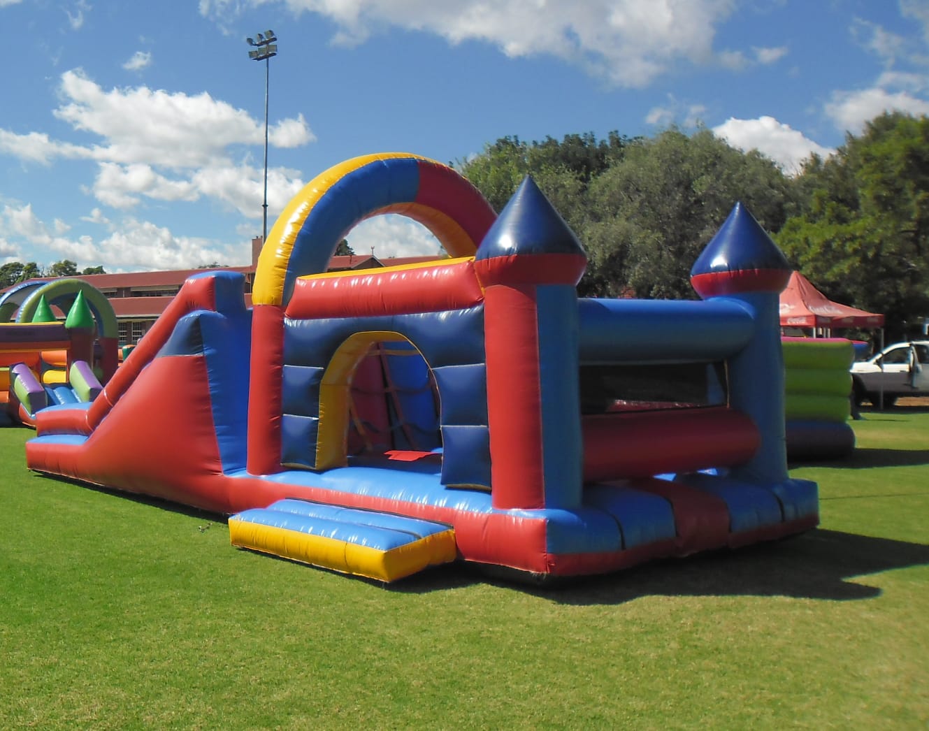 Colorful inflatable jumping castle set up on grass
