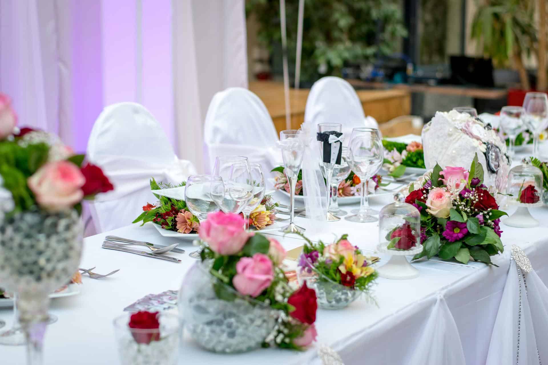 Decorated table with flowers and glassware