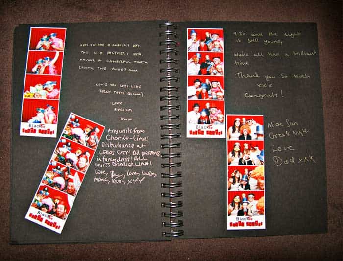 A custom memory book filled with photo strips and handwritten notes.