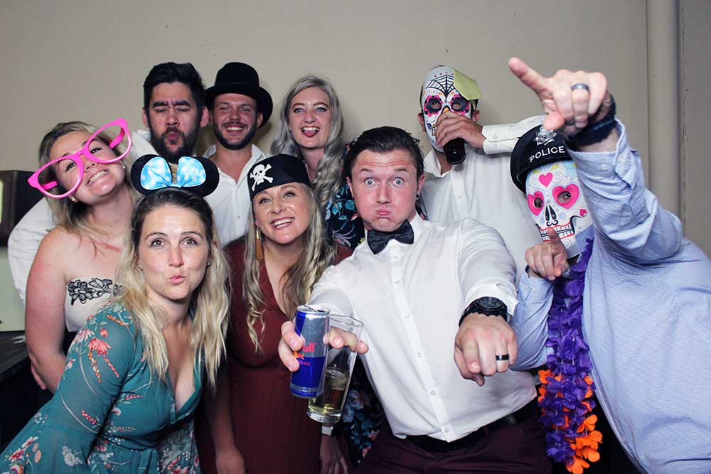 Group of guests enjoying a photo booth at an event.