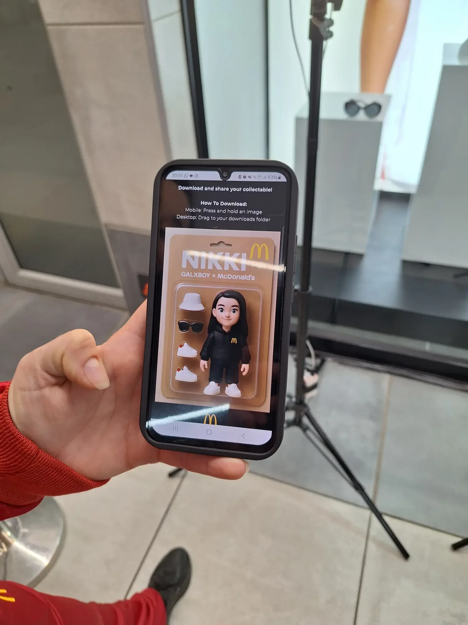Smartphone displaying a digital collectible figure named NIKKI
