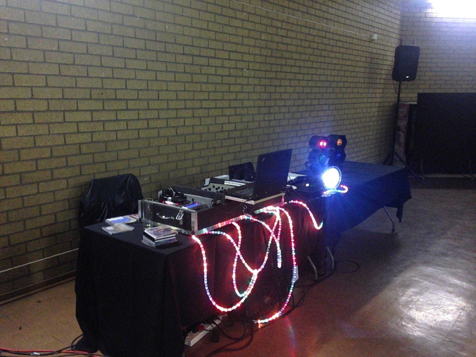 DJ equipment with colorful lights at an event space