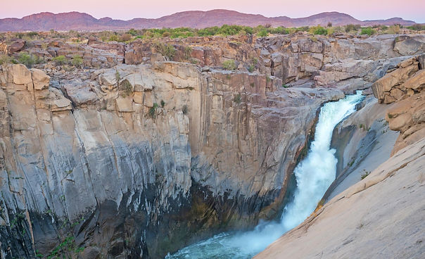 Aerial view of a waterfall and rocky terrain