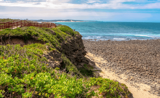 Coastal view with rocky beach and cliffs