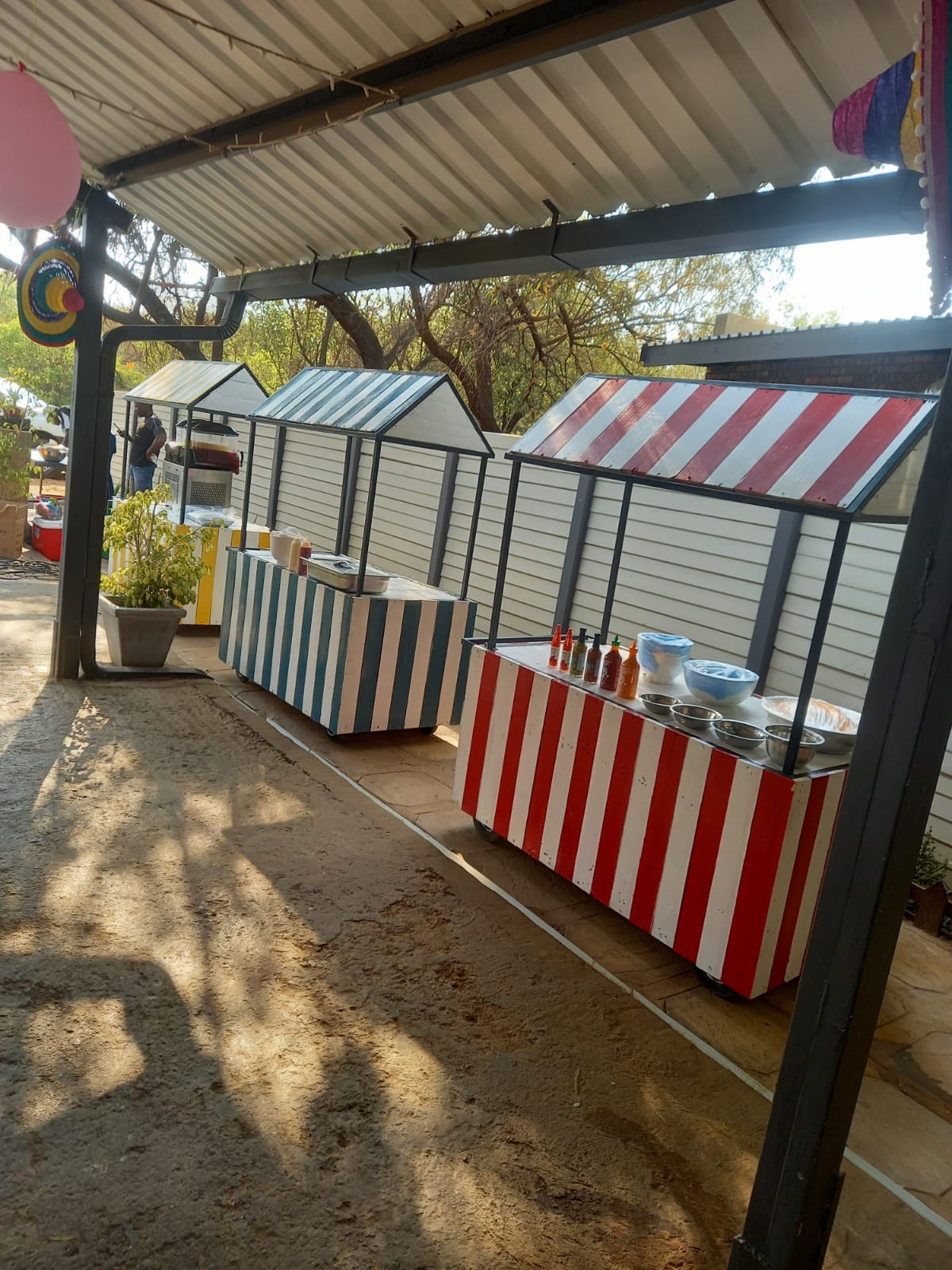 Colourful food carts in an outdoor event space