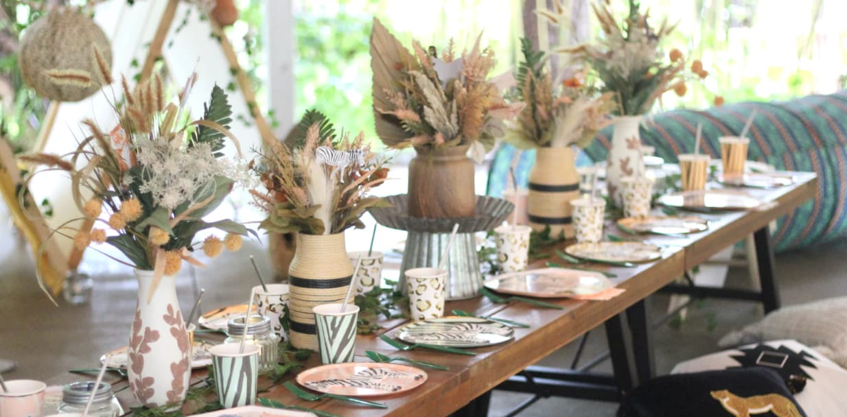 Table with floral centerpieces and elegant tableware