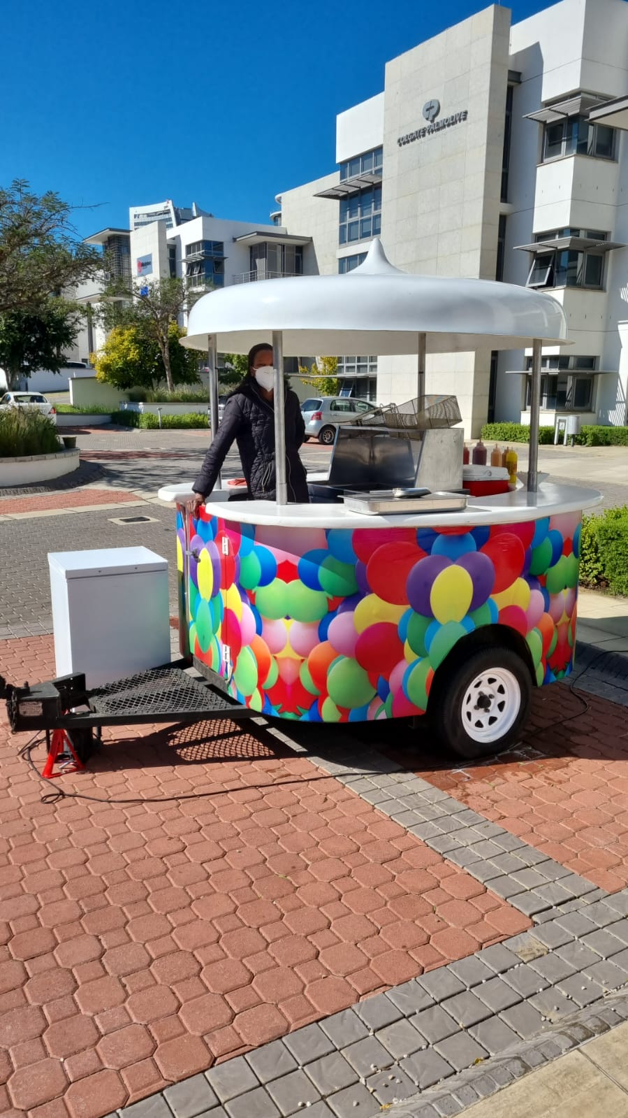 Popcorn cart with colorful balloon design