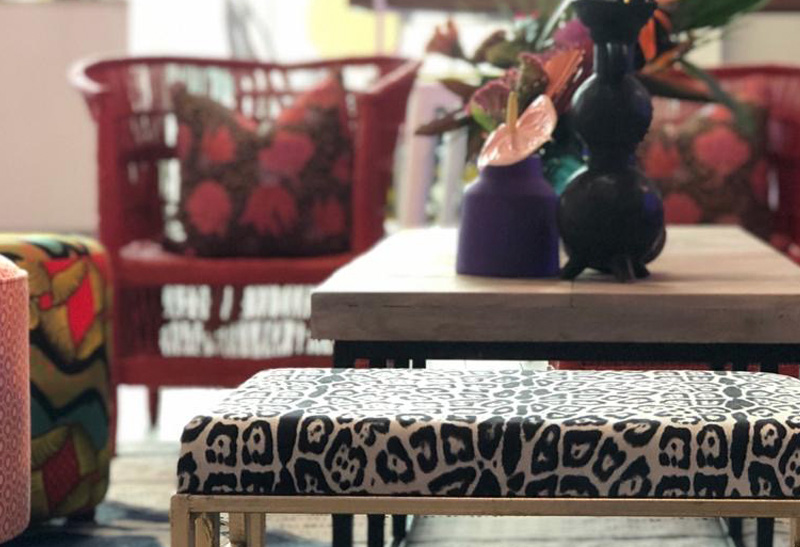 Vibrant lounge area with colorful chairs and decor