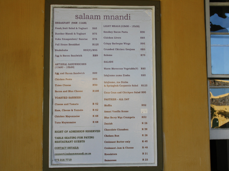 Menu board displaying various meal options at Salaam Mnandi
