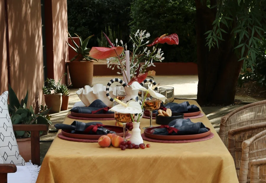 Curated table setting with plates, napkins, and decorative elements.