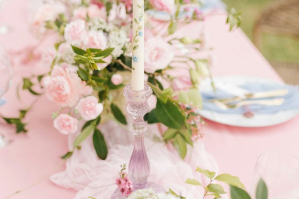Decorative table with pink flowers and a candle