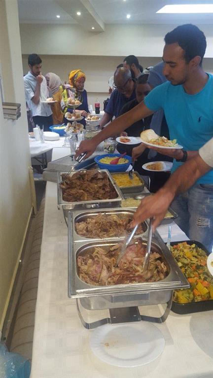 Guests serving Halaal food from catering trays