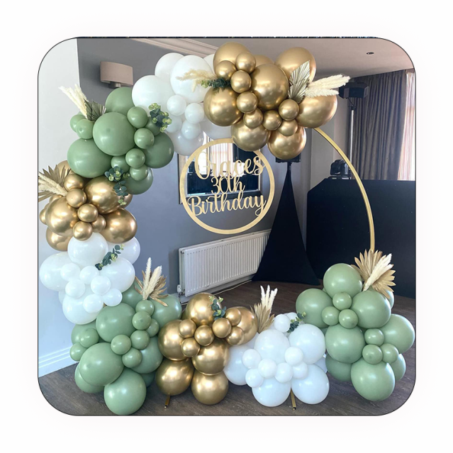 Custom balloon arch with gold and green balloons for a birthday.
