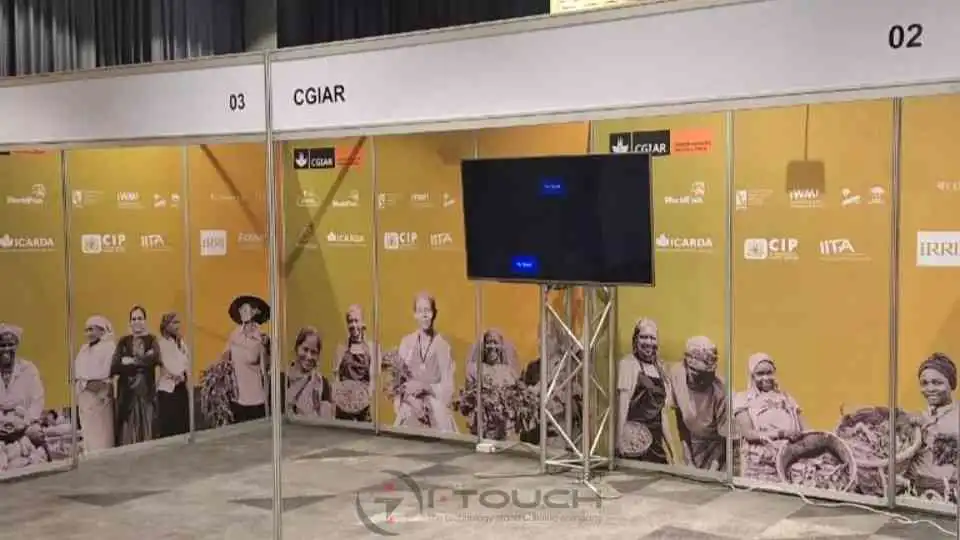 Exhibition stand with visuals and an interactive screen.