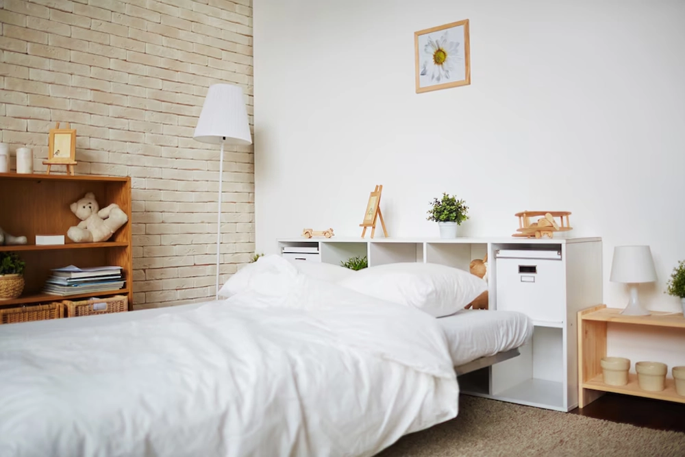 Neatly made bed in a cozy bedroom with natural decor.