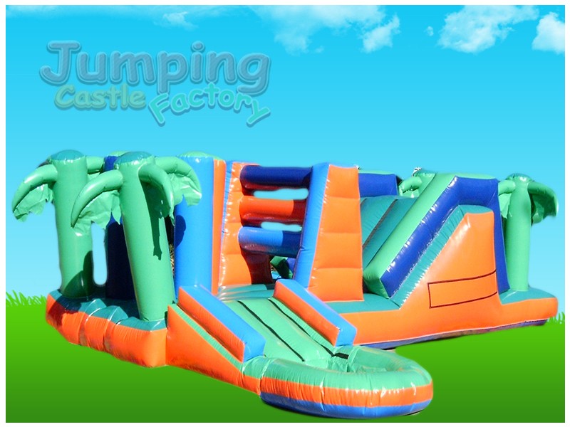 Inflatable tropical water castle with palm trees and vibrant colors.