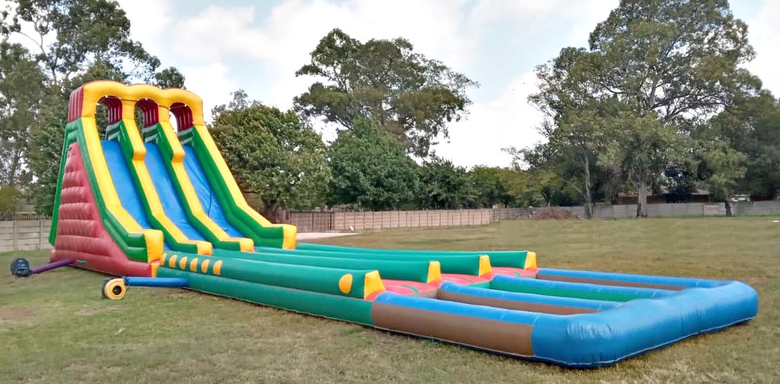 Large colorful inflatable slide in an outdoor setting