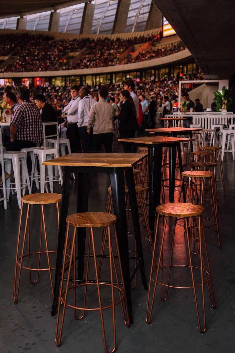 Copper bar table with matching stools at an event venue