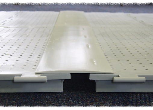 Close-up of interlocking black and white flooring panels