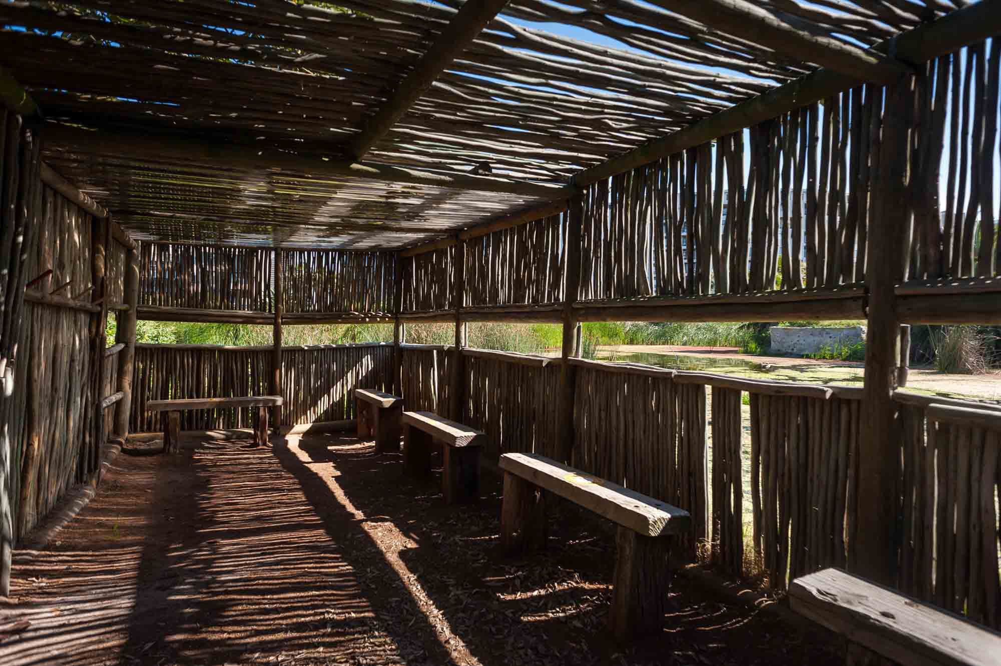 Interior of a wooden lapa with benches