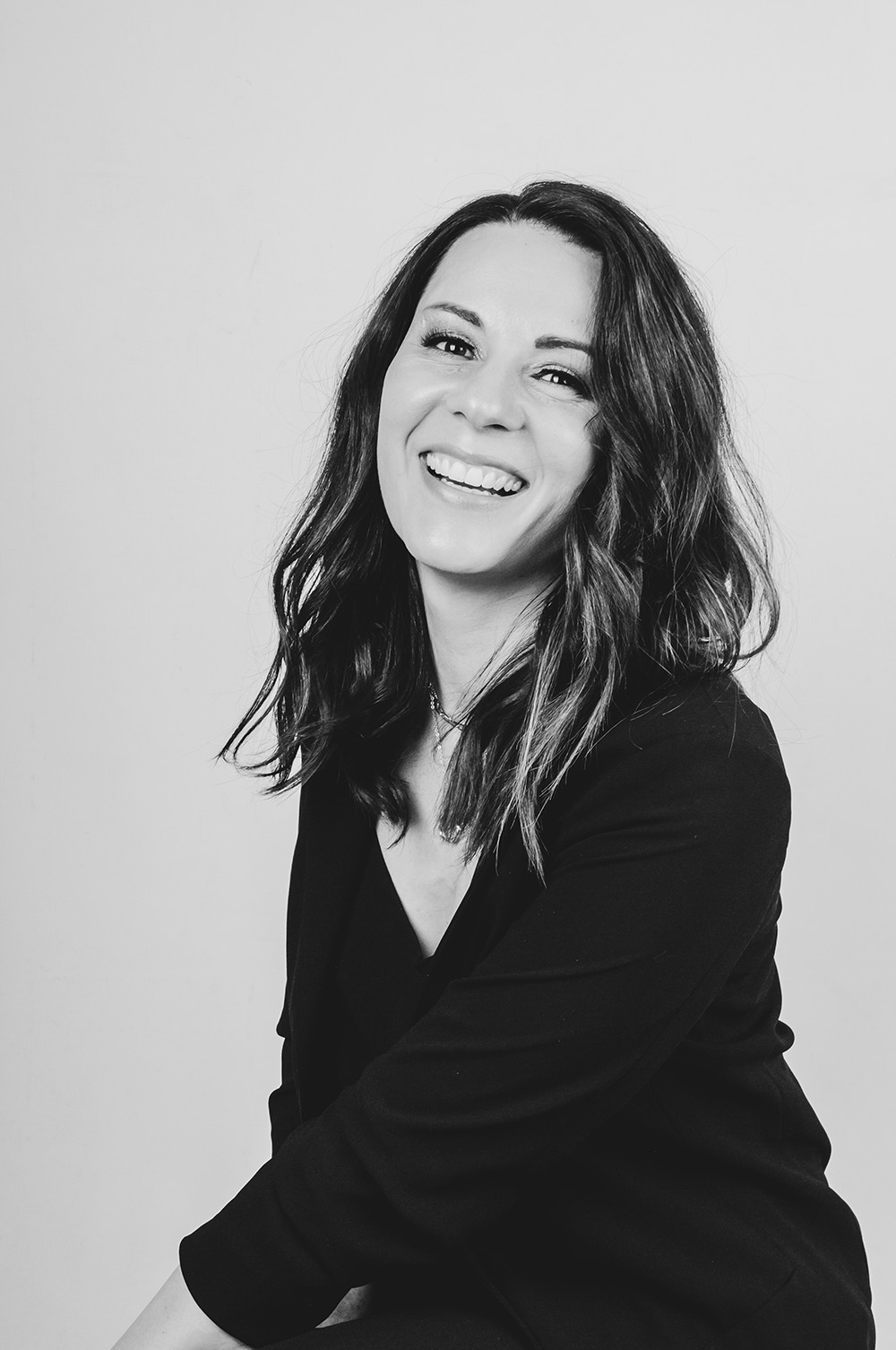 Black and white portrait of a smiling woman
