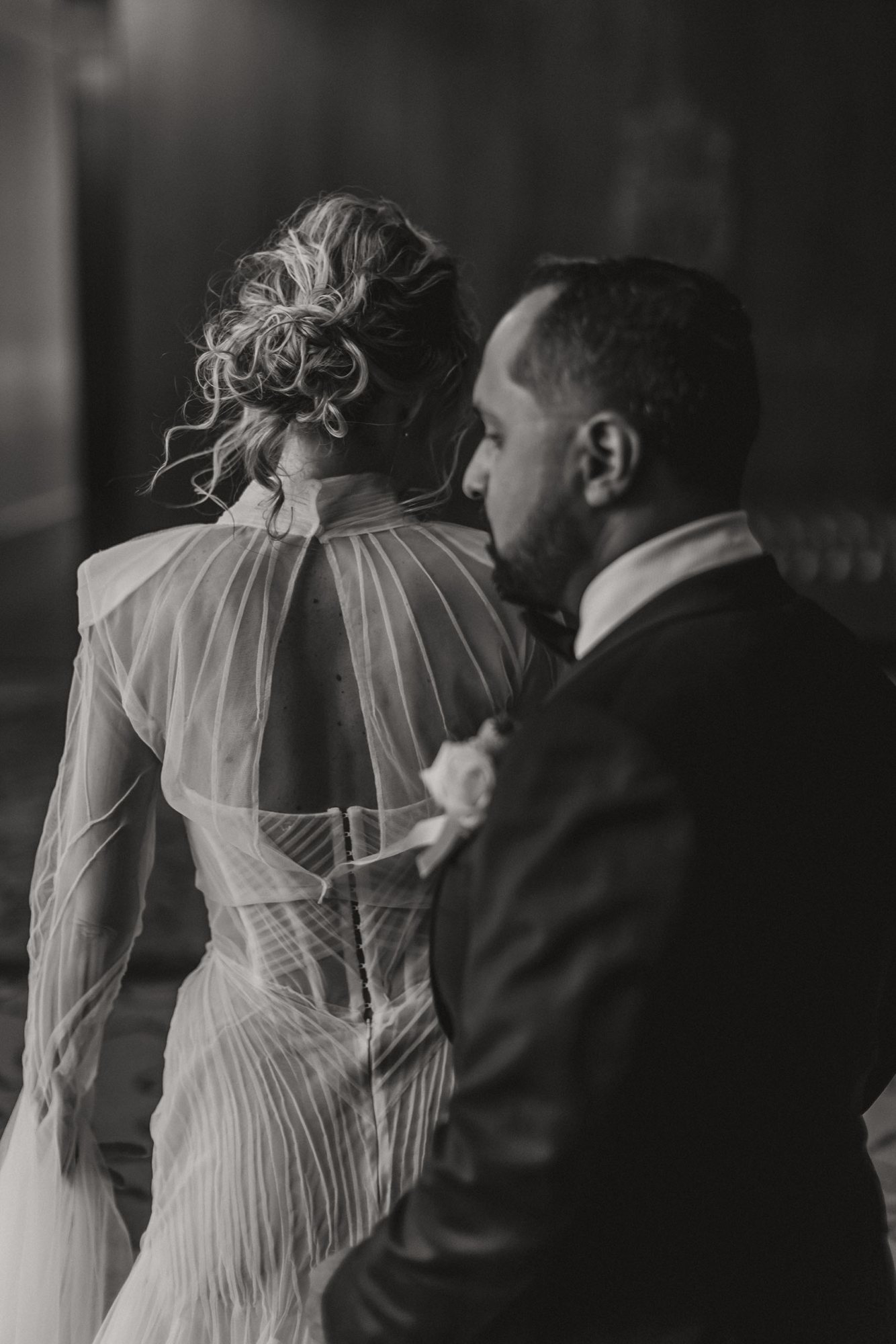 A bride and groom captured in a private moment before the ceremony.