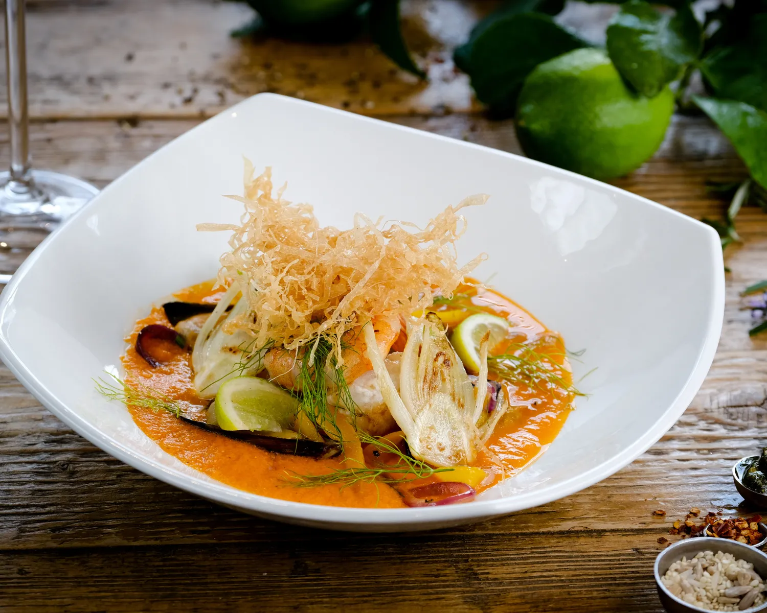Plated gourmet dish with seafood and garnishes