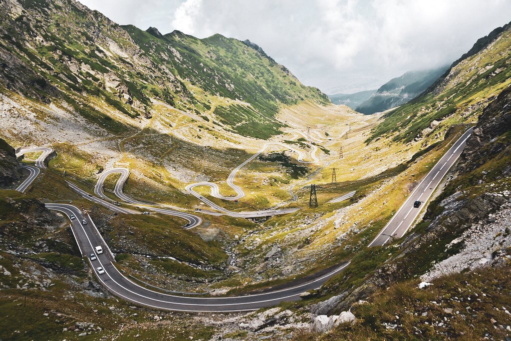 A winding road through a mountainous landscape
