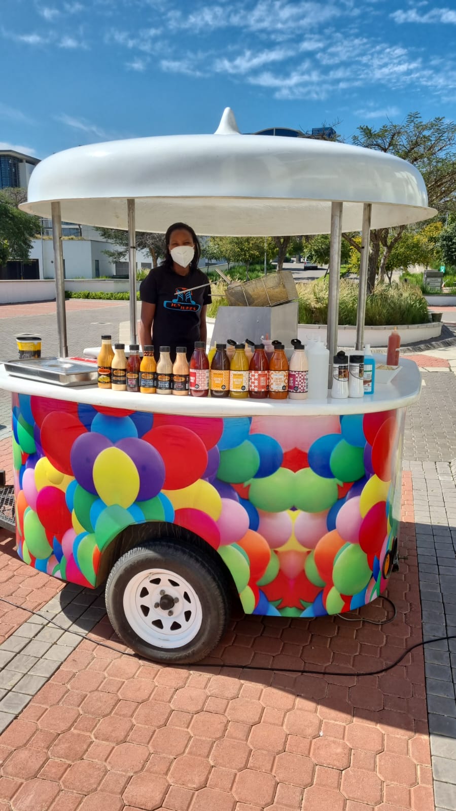Colorful carnival food cart with snacks and drinks