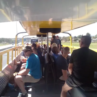 Interior view of guests enjoying an open top party bus in Johannesburg.
