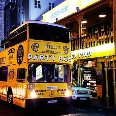 Open top party bus parked outside Beerhouse in Johannesburg