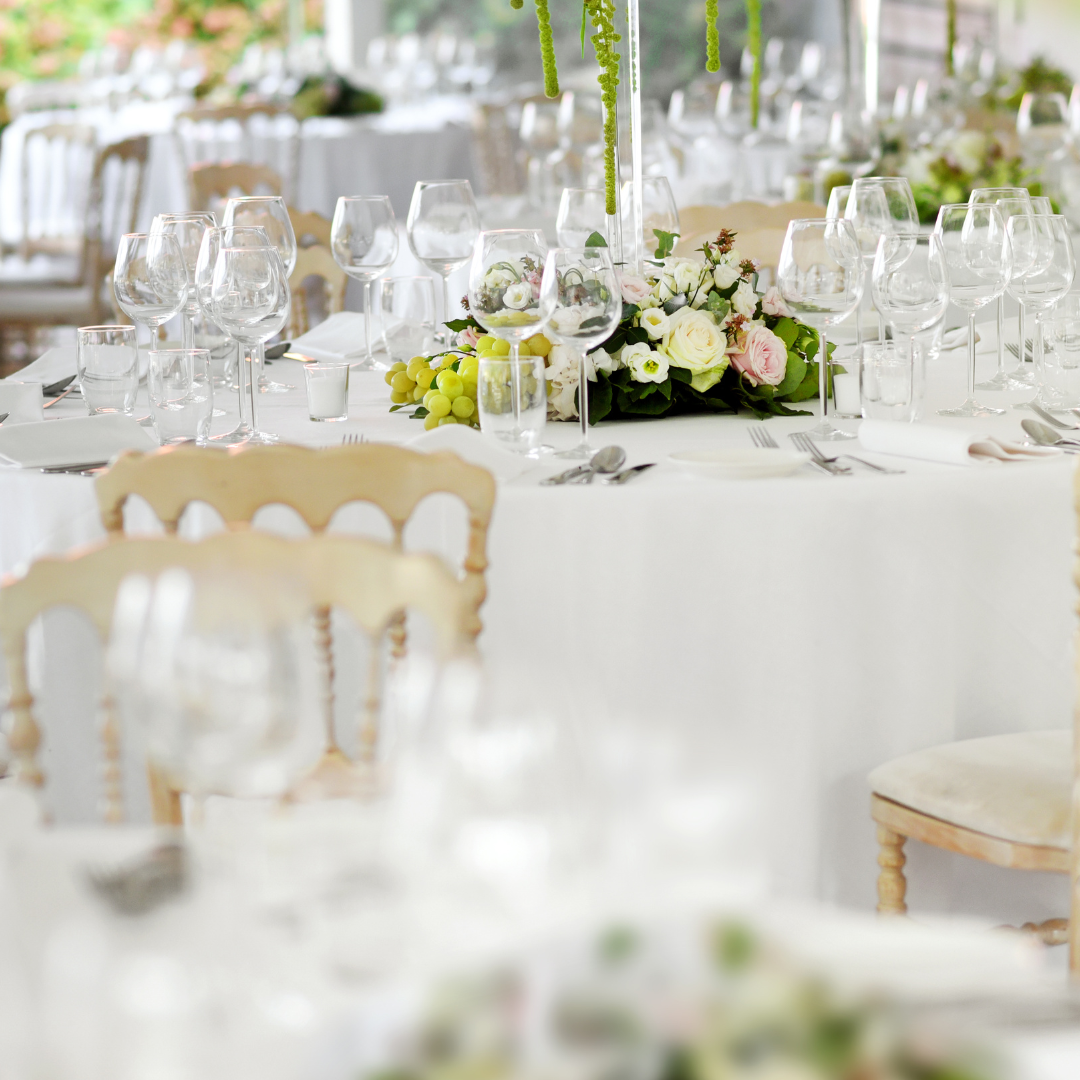 Dining table set with glassware and floral centerpiece