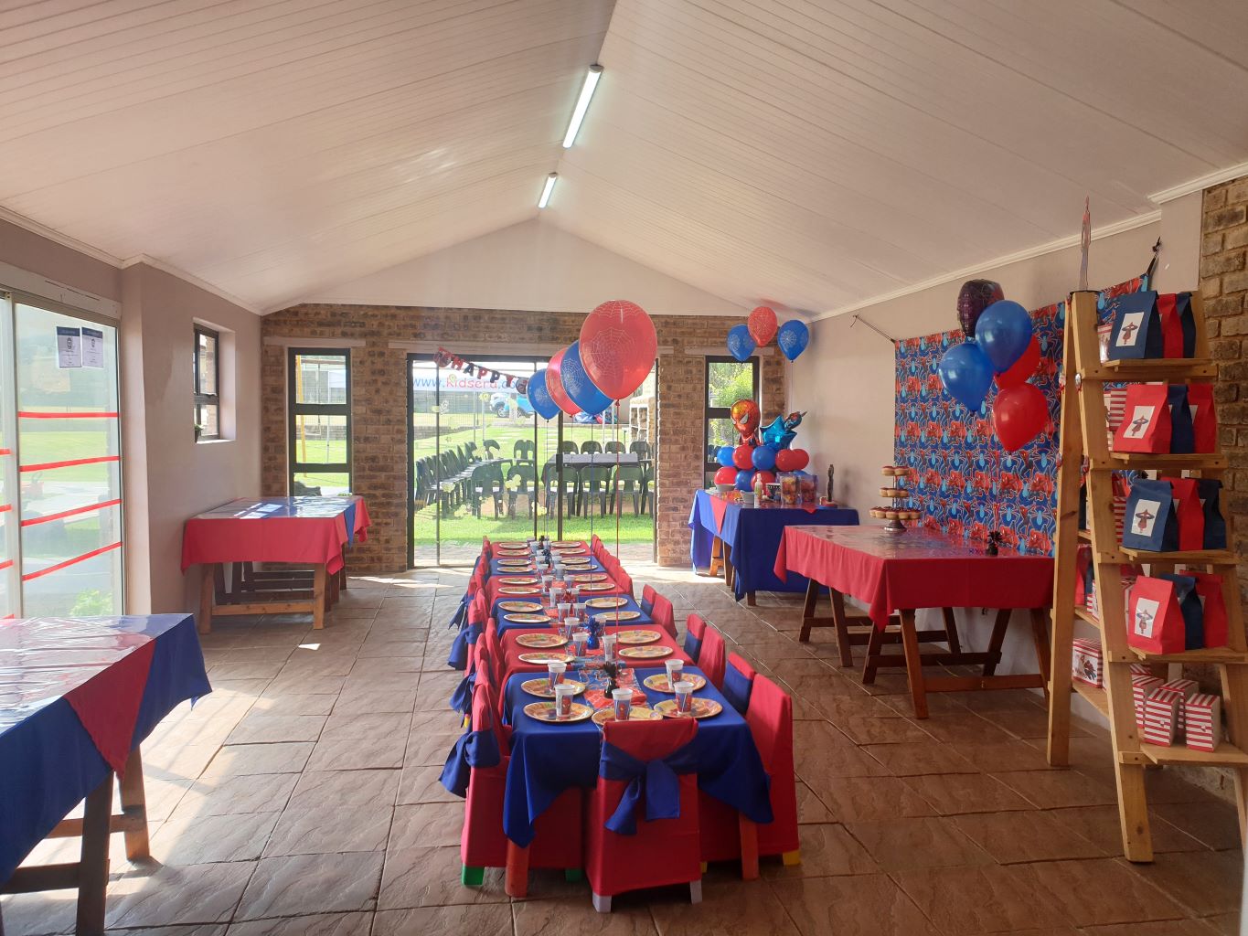 Colorful kids' party setup with tables and decorations